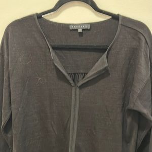 Black v neck knit tunic with shear hem